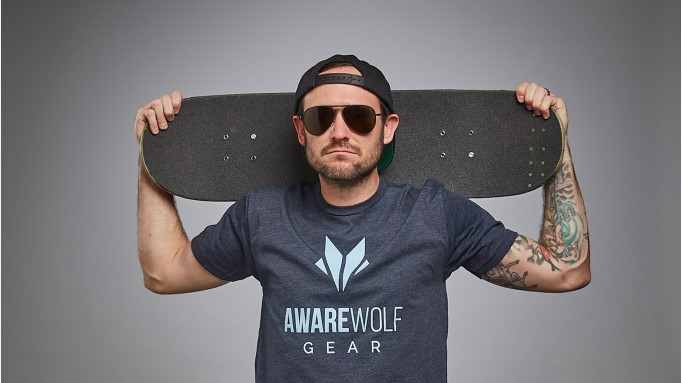 Justin Bishop adaptive skateboarder in Awarewolf t-shirt